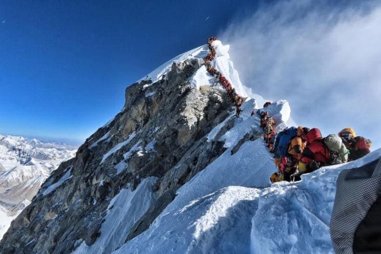 Line of climbers waiting to reach Mount Everest peak